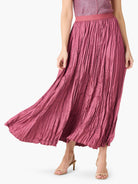 Deep pink, floor-length skirt with a crinkled, crushed texture and a smooth waistband.