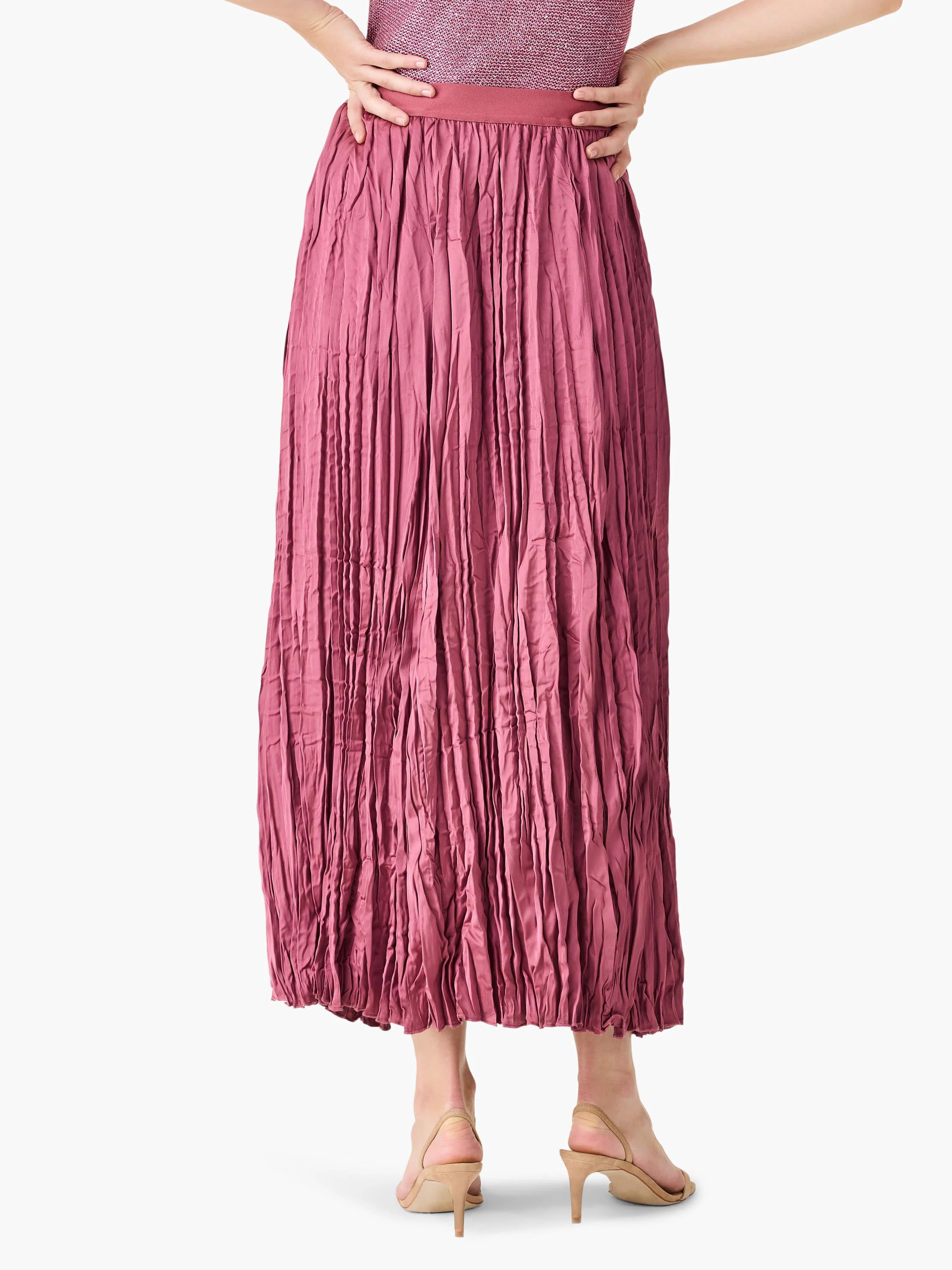 Long, mauve pink crinkle-crush skirt with distinct vertical pleats, shown from behind.