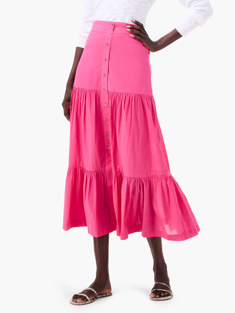 Hot pink tiered cotton midi skirt with a front button placket.