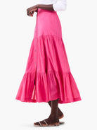 Hot pink tiered cotton midi skirt with a front button placket.