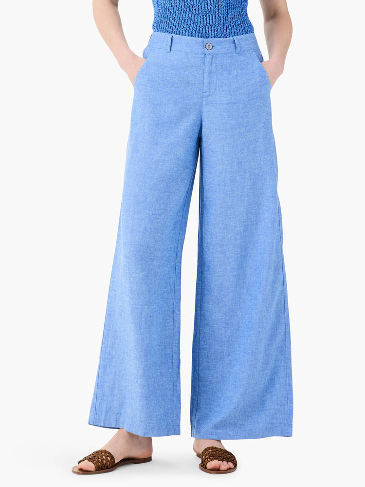 Light blue linen wide-leg trousers.  The fabric has a slight texture.  Shown on a model.