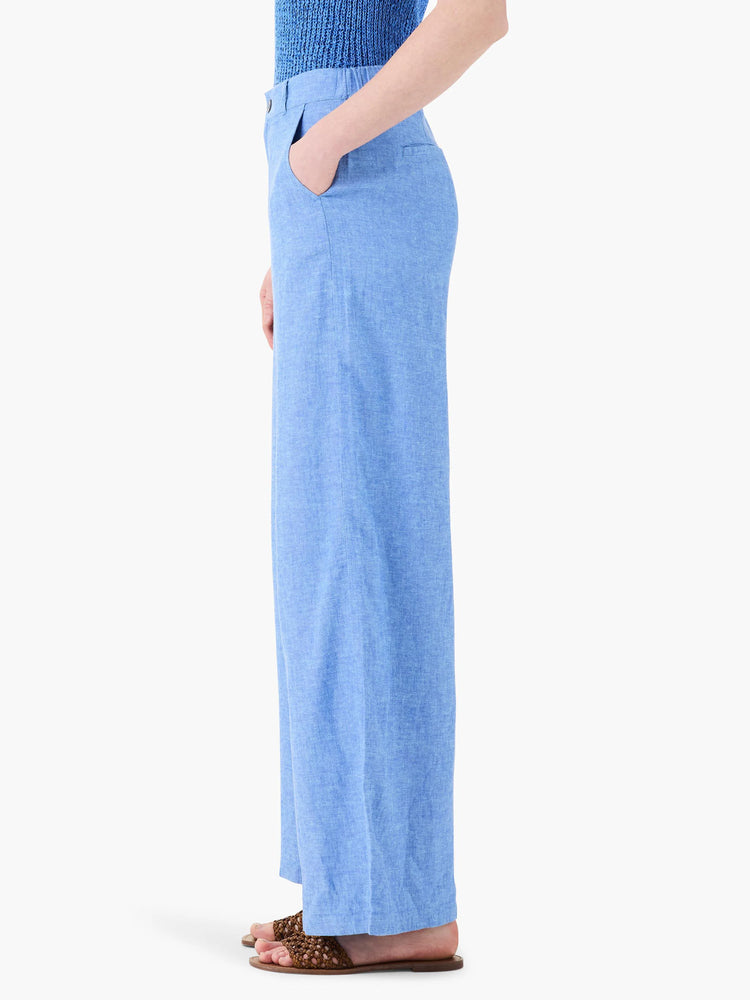 Side view of light blue linen wide-leg trousers.  The fabric has a subtle texture.