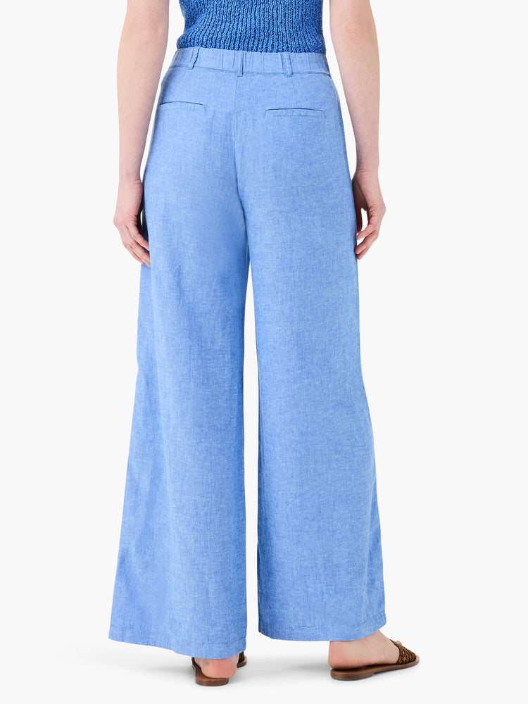 Here's alt text for the image, under 125 characters:

"Light blue linen wide-leg trousers, seen from the back.  Elastic...