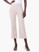 Light beige high-waisted wide-leg crop pants with front creases, worn by a model.