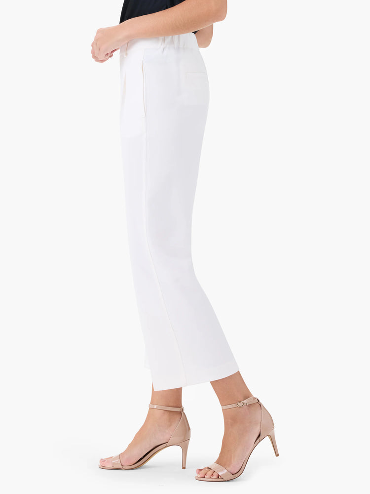 Off-white wide-leg cropped trousers.  Model wears nude heels.