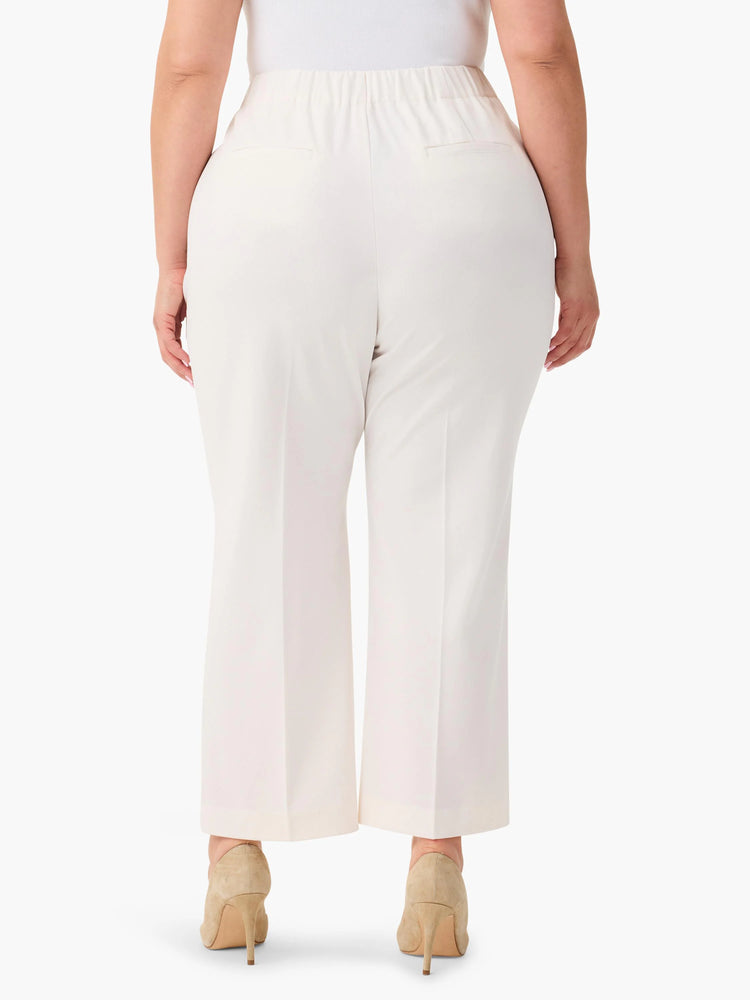 Off-white wide-leg cropped trousers; elastic waistband, back pockets.  Model wears nude heels.