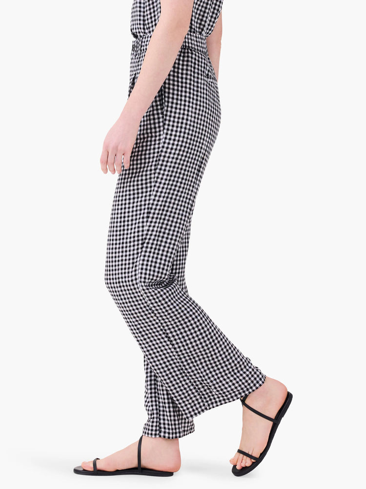 Black and white gingham wide-leg pants.  Model shown wearing black sandals.