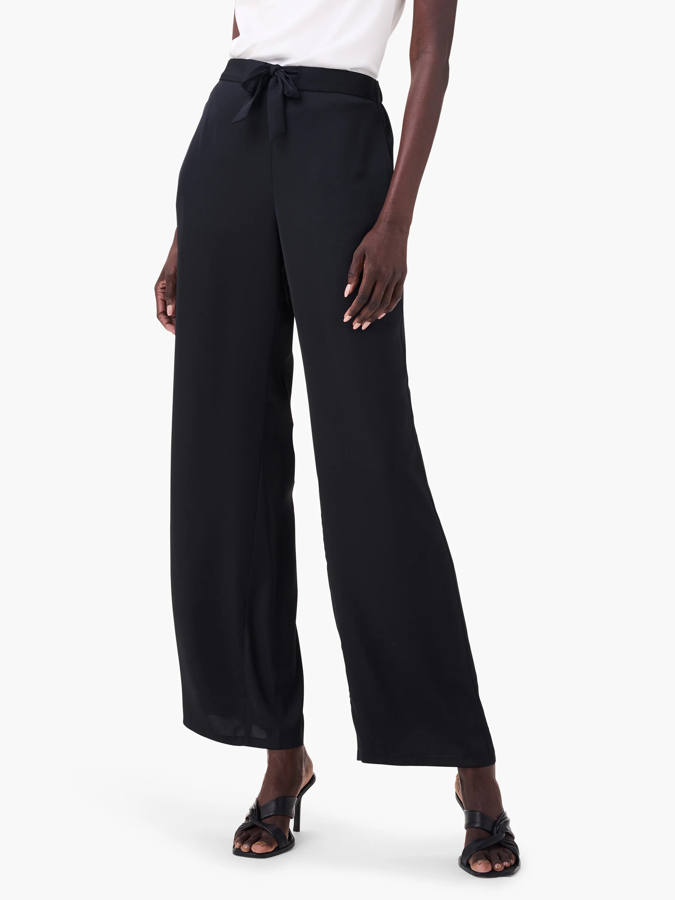 Black wide-leg pants with a drawstring waist.  Shown on a model.