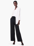 Black wide-leg pants;  model wears off-white shirt.  Drawstring waist.