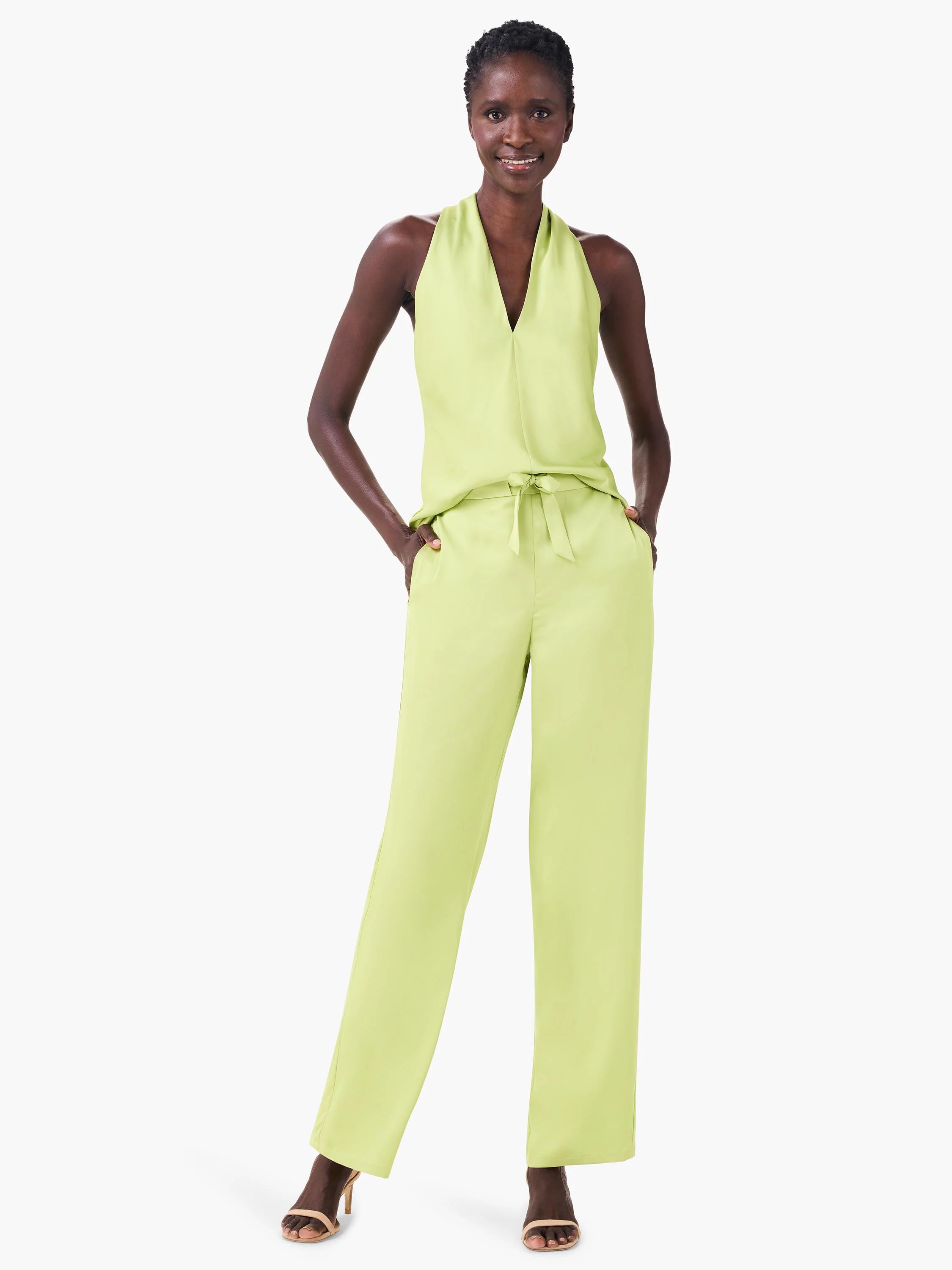 Light lime green, wide-leg pants with a tie waist.  Model is wearing them with a matching top.