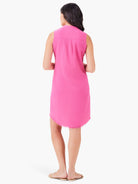 Pink sleeveless linen dress,  A-line silhouette,  raw hem. Back view.