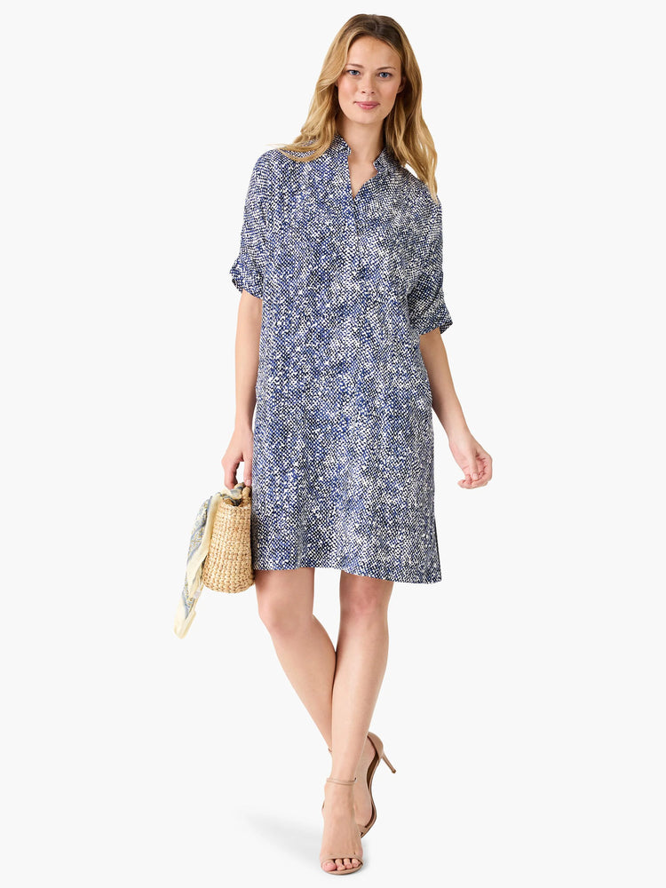 Navy blue and white patterned knee-length dress, short sleeves, collared neckline.