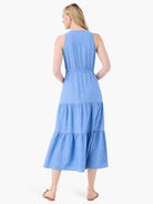 Light blue, sleeveless midi dress with tiered skirt and drawstring waist.  Shown from the back.