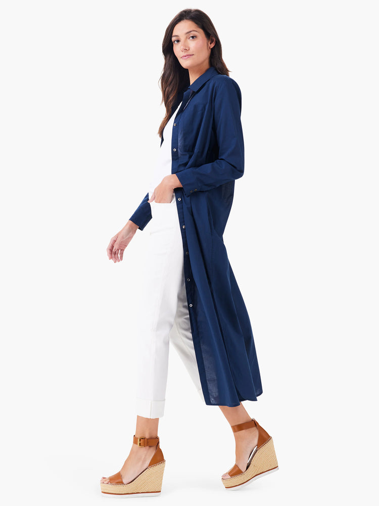 Navy blue, knee-length collared tunic; long sleeves; button front.