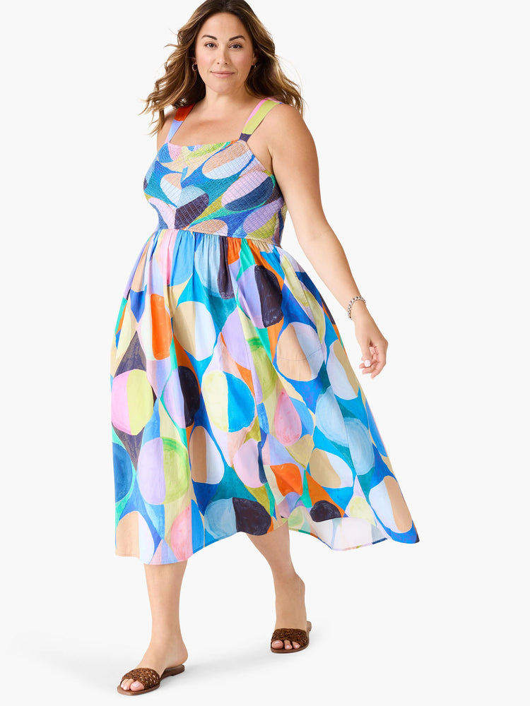 Midi dress, sleeveless, square neck.  Abstract print in blue, orange, purple, green, and beige.  A-line silhouette.