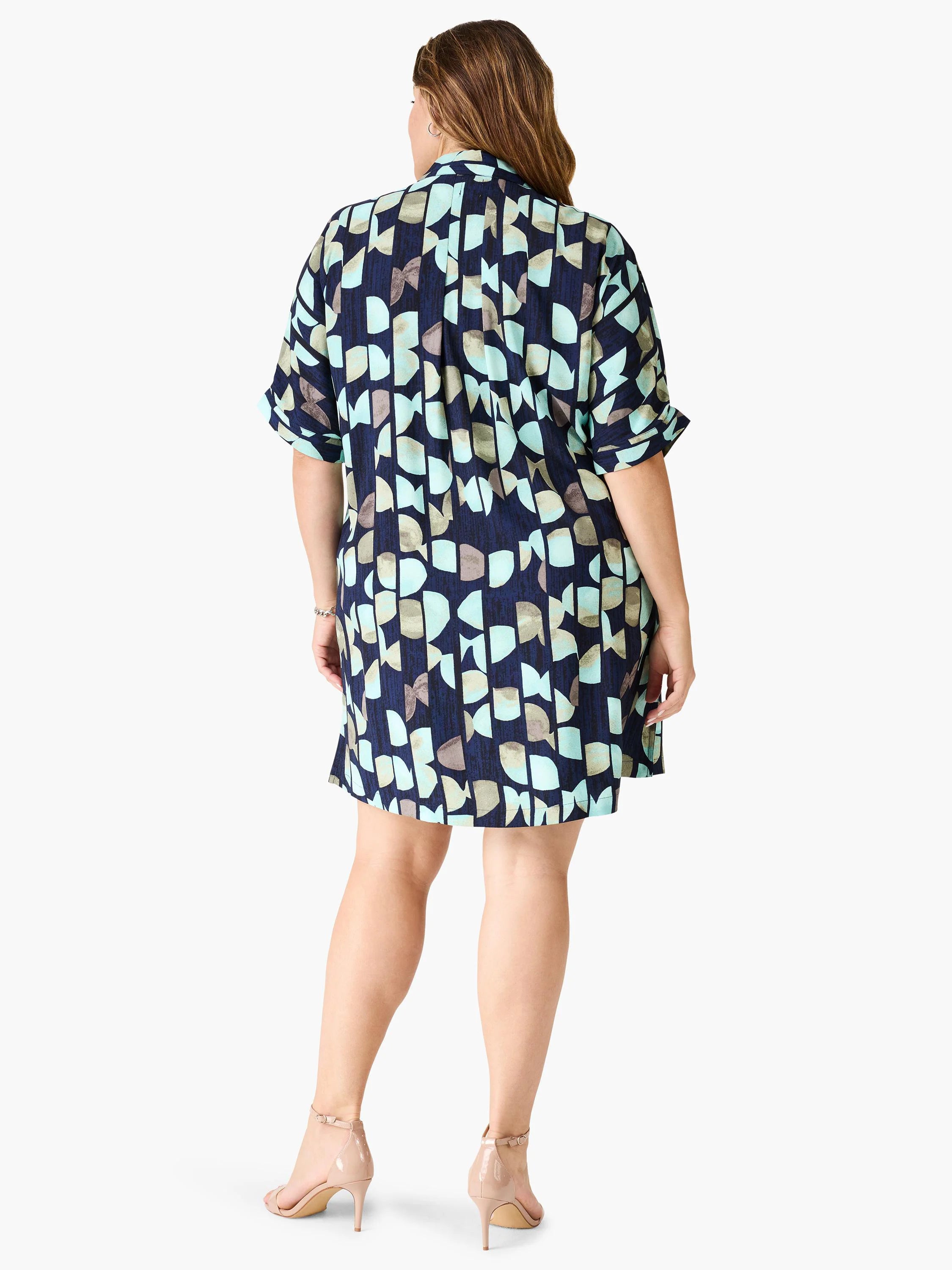 Navy blue shirt dress with teal, gray, and beige abstract print. Short sleeves. A-line silhouette.