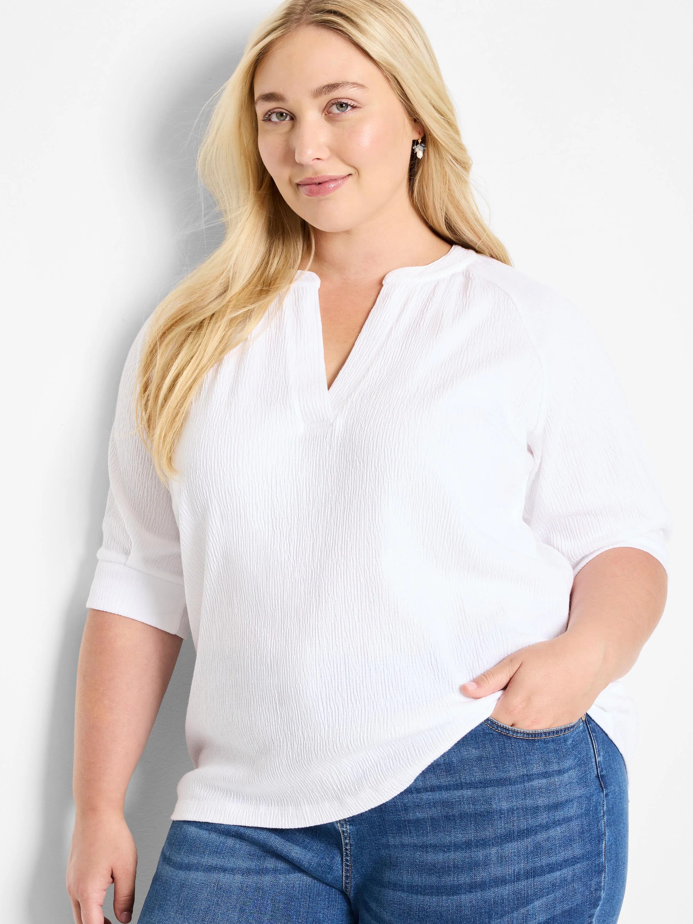White, textured knit top.  V-neck, 3/4 sleeves.