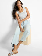 Shimmering silver ribbed tank with scoop neck.