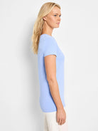 Side view of a light blue crew neck t-shirt with short sleeves and a smooth knit texture.
