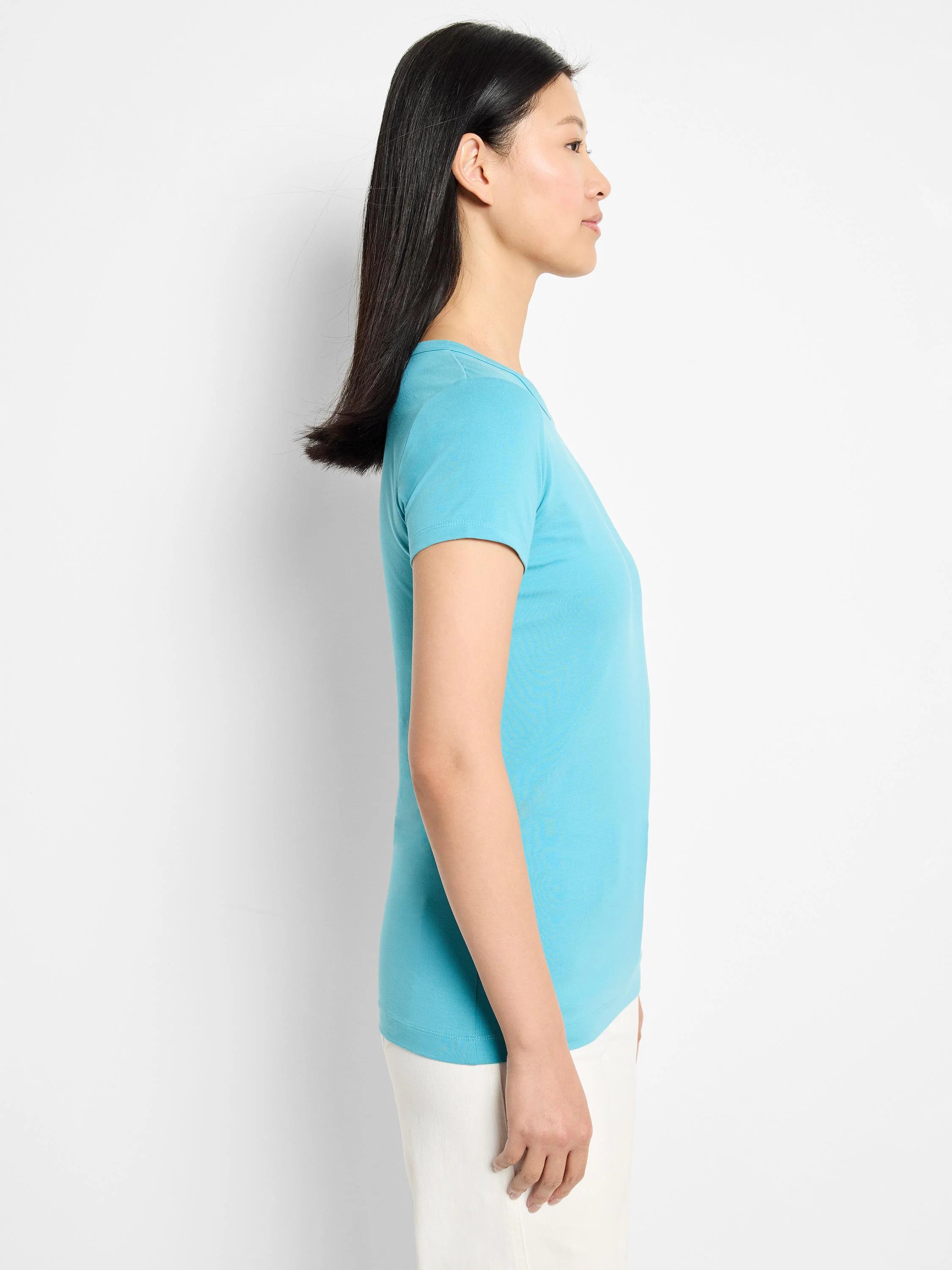 Light blue crew neck t-shirt. Short sleeves, smooth knit texture, semi-fitted silhouette.