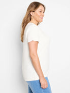 Off-white textured short-sleeve tee.  The fabric has a slightly raised, uneven surface.