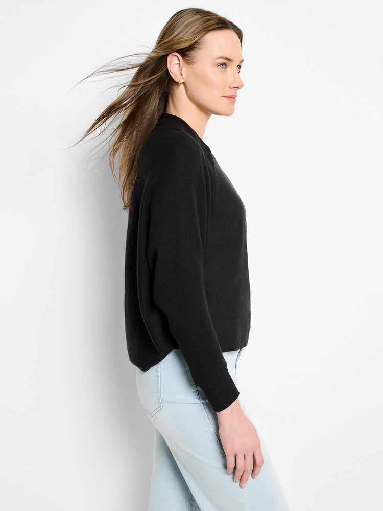 Black cotton cashmere shrug cardigan, long sleeves, shown on model.