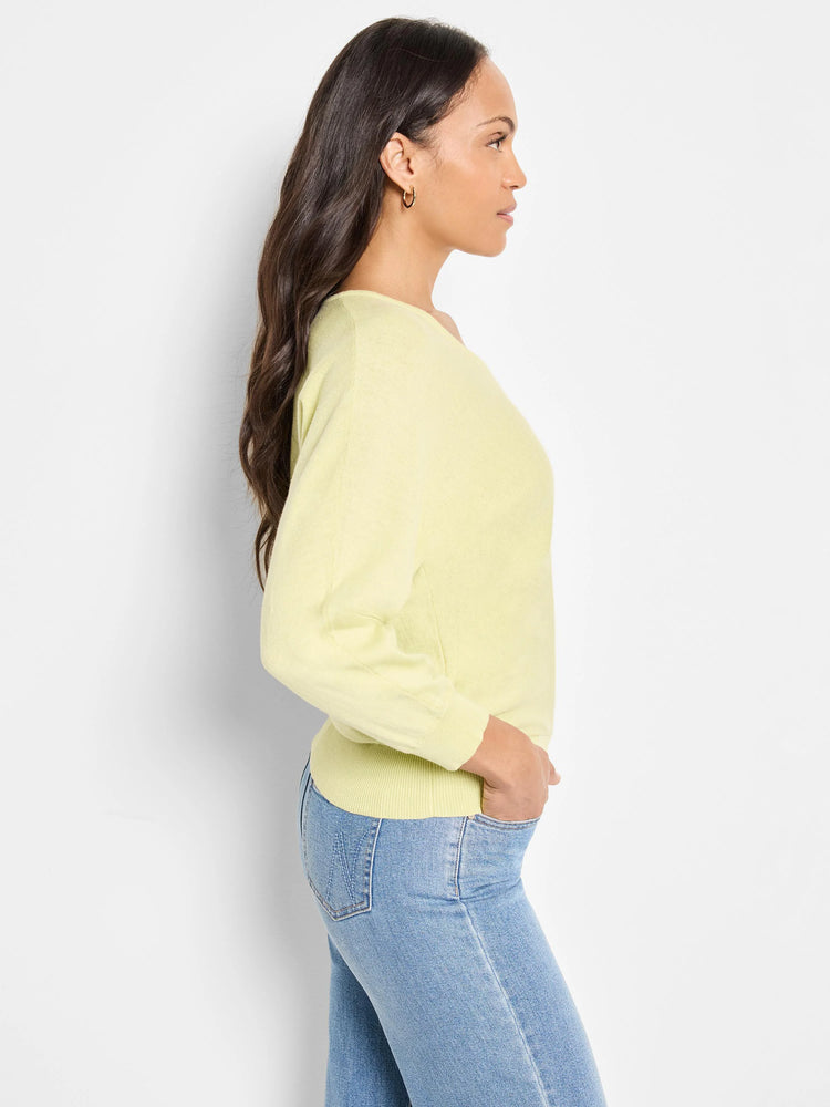 Pale yellow V-neck sweater, three-quarter sleeves.  Side profile shown.