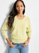 Pale yellow cotton v-neck sweater, three-quarter sleeves, fitted waist.
