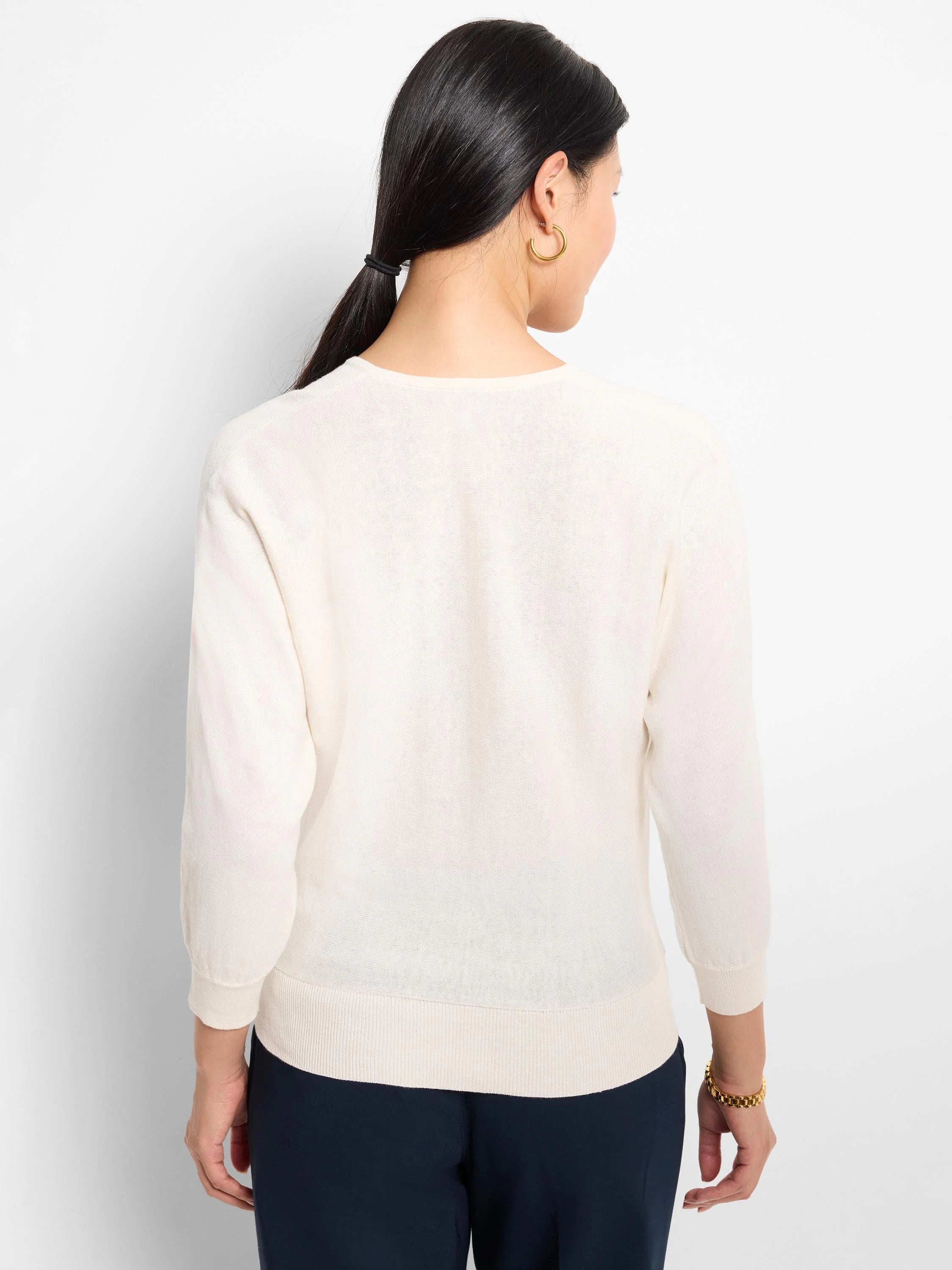 Off-white V-neck cotton sweater, three-quarter sleeves, shown from the back.