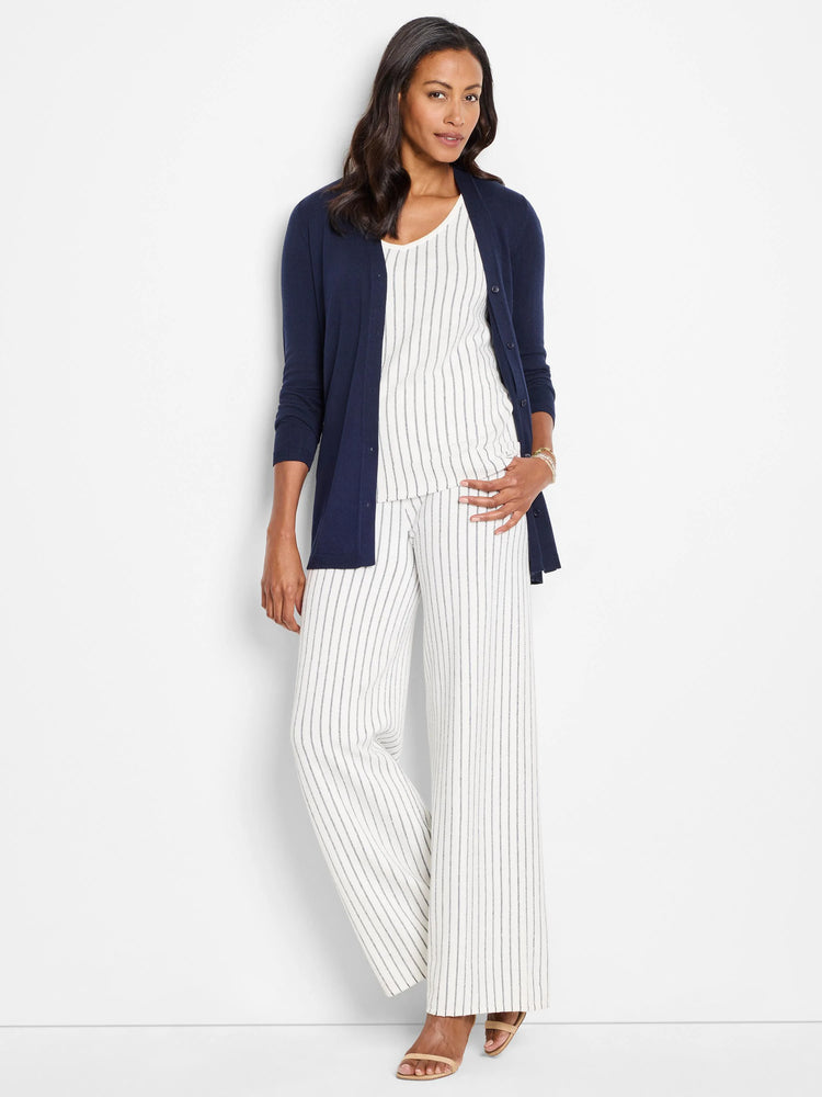 Navy blue button cardigan.  Model also wears off-white pinstripe pants.