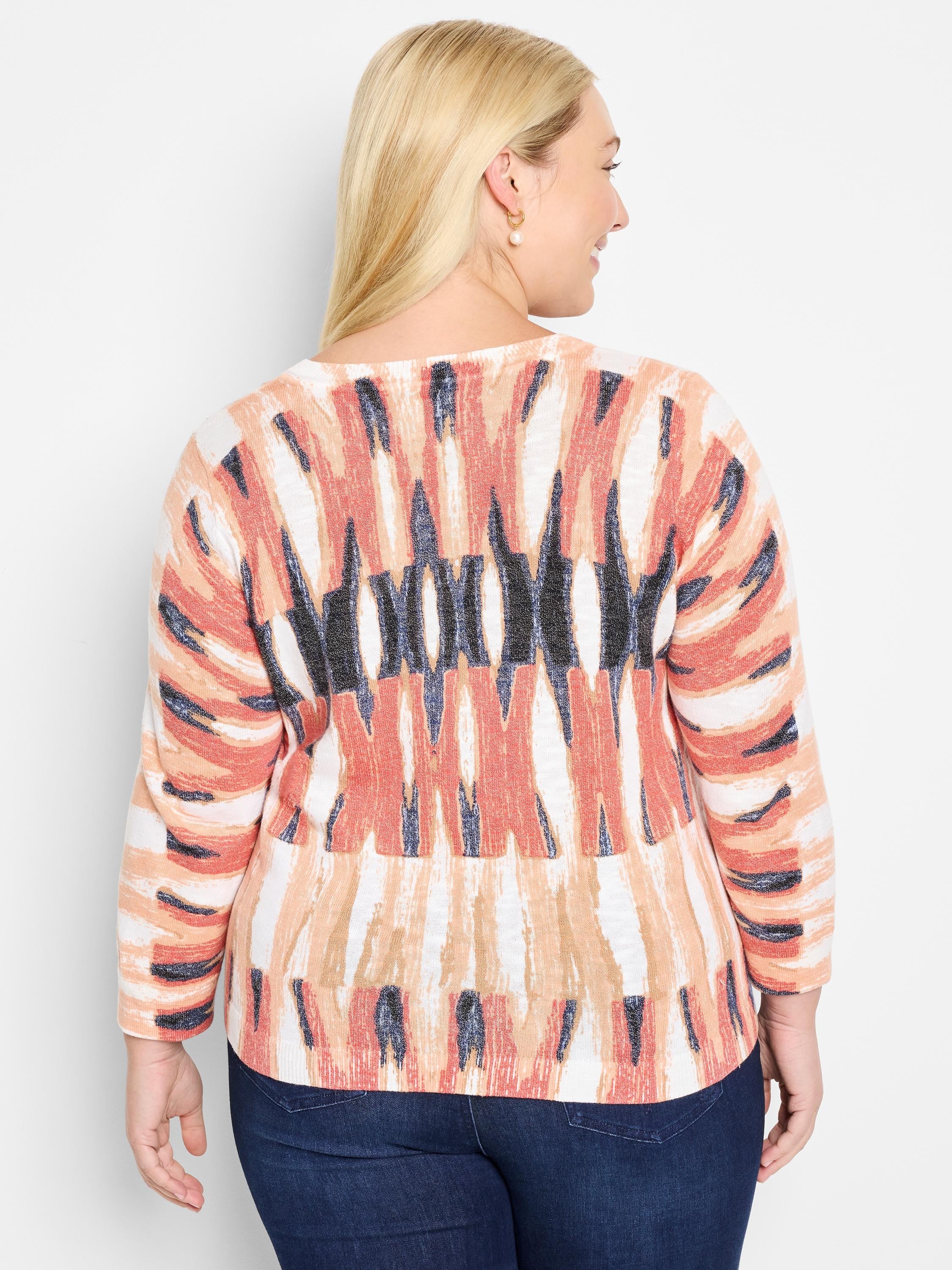 Here's alt text for the image, under 125 characters:

"Crisscross cotton sweater, rear view.  Features a cream base with...