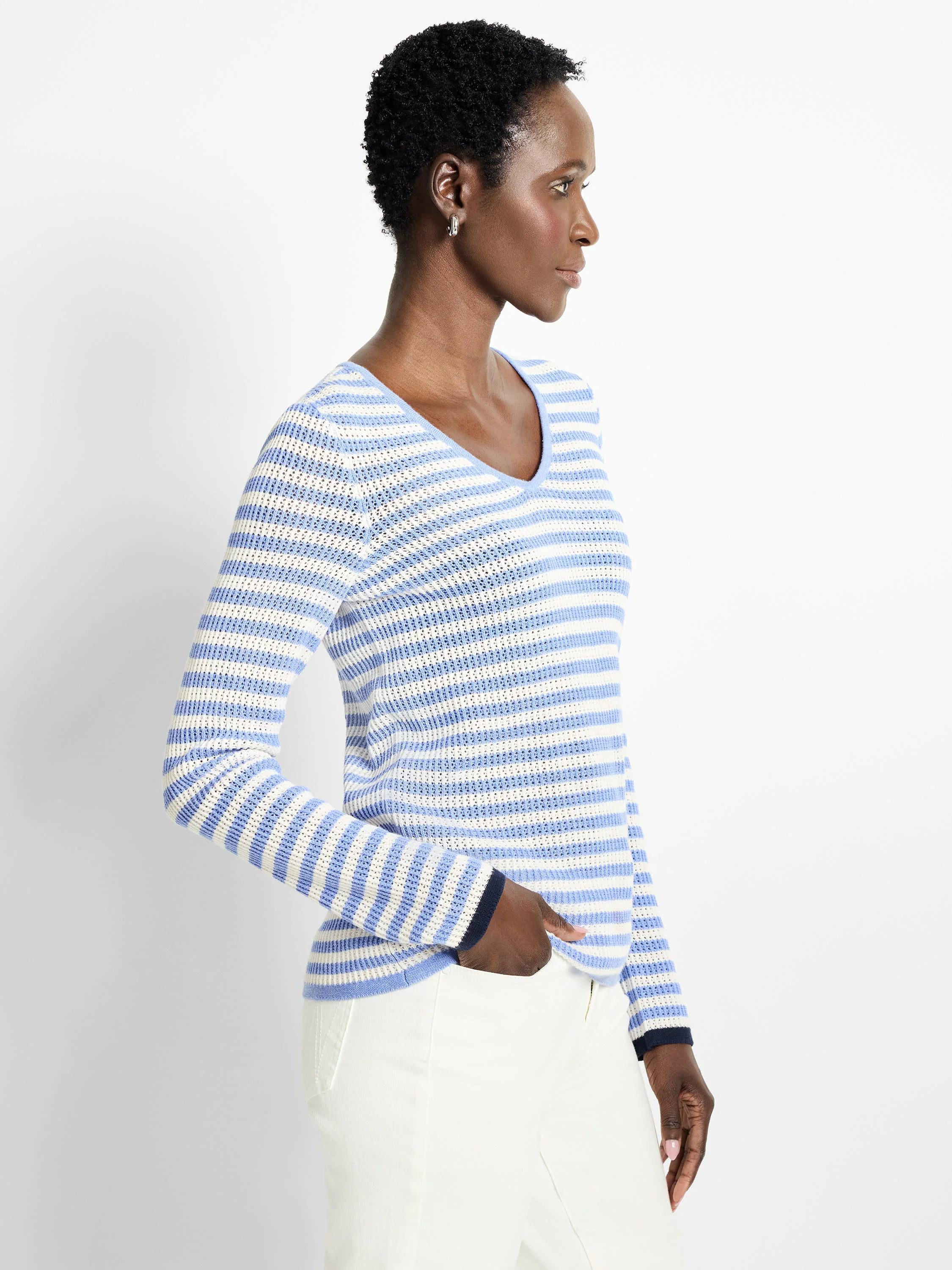 Light blue and white horizontal striped, long-sleeved v-neck sweater. Mesh knit.  Navy blue cuffs.