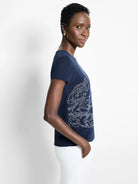 Navy blue short-sleeve sweater tee with a white floral design. Ribbed texture.