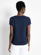 Dark navy blue, ribbed knit short-sleeve tee.  Slight white detail at shoulder.