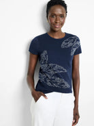 Navy blue short-sleeved sweater tee with lighter gray leaf design. Ribbed texture.