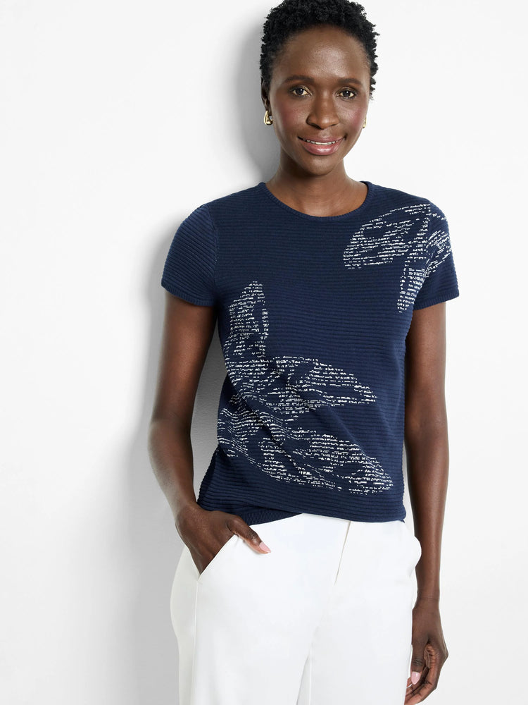 Navy blue short-sleeved sweater tee with lighter gray leaf design. Ribbed texture.