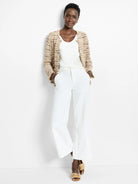 Beige, brown, and white knit jacket.  Open front, three-quarter sleeves.
