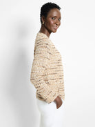 Beige knit jacket with brown and white flecks.  Long sleeves, relaxed fit.