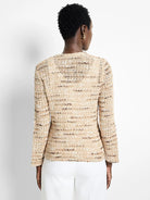Beige knit jacket with brown and white flecks, long sleeves, and a textured appearance.