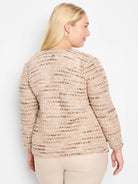Beige knit jacket with subtle pink and brown flecks.  Long sleeves, close-fitting.