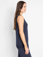 Navy blue sleeveless knit tank top with thin white vertical stripes.