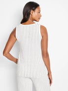 White sleeveless knit tank with thin, dark vertical stripes.  Back view.