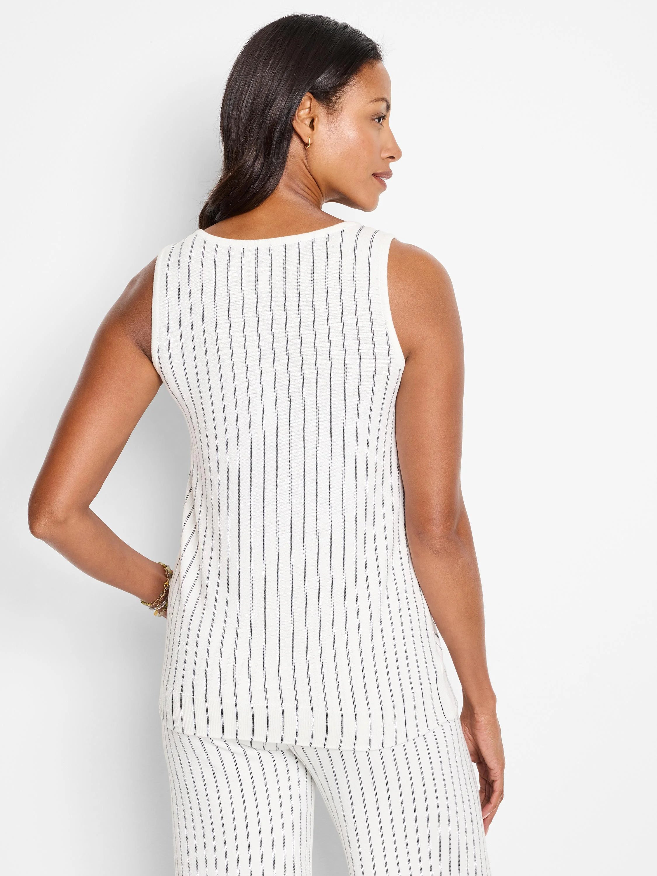 White sleeveless knit tank with thin, dark vertical stripes.  Back view.