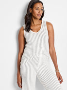 Off-white sleeveless knit tank top with thin, dark vertical stripes.