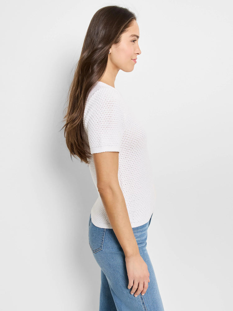 White short-sleeved, open-knit sweater tee.  Side profile view.