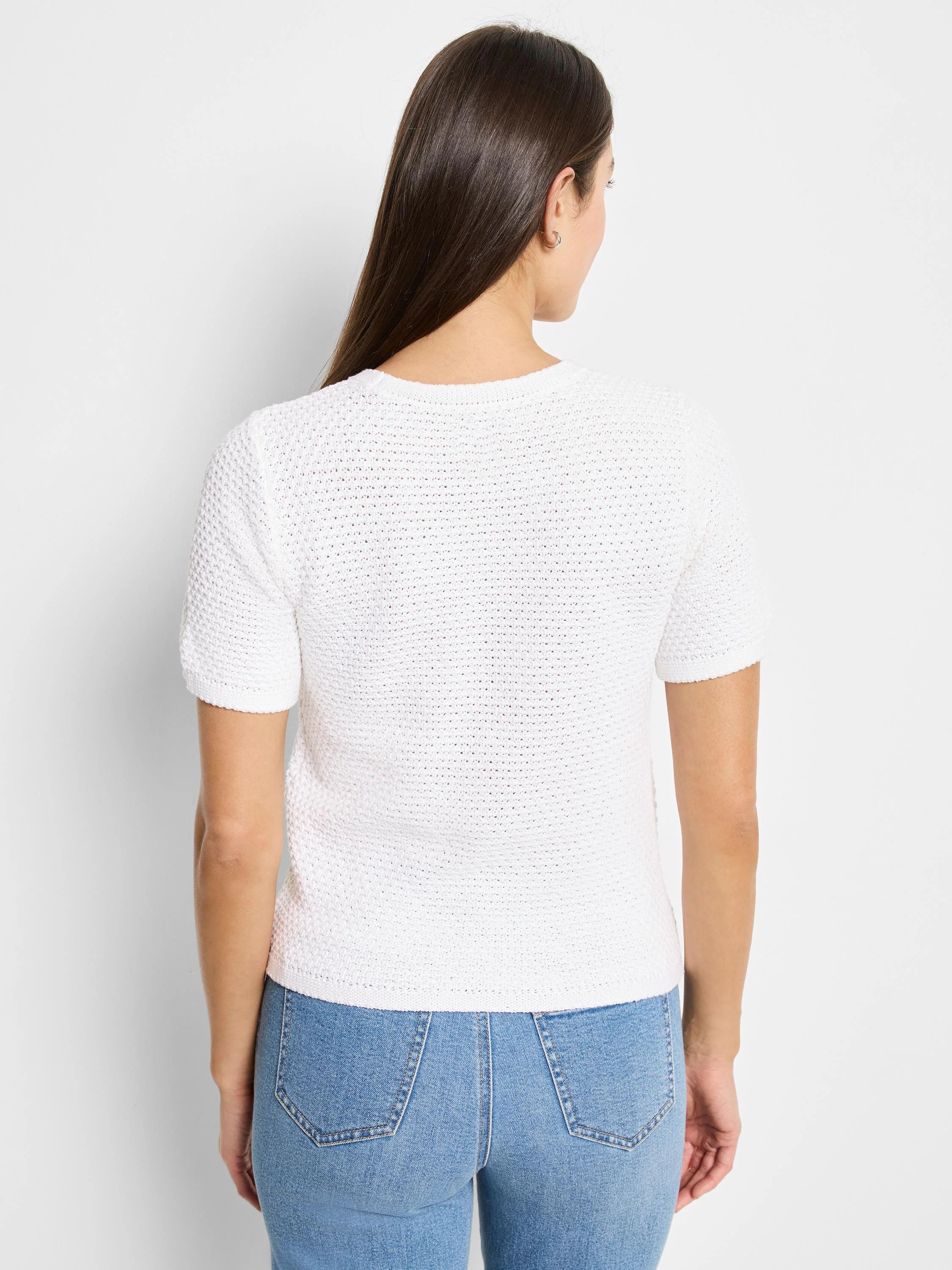 White short-sleeve knit sweater tee with textured fabric.  Shown from the back.