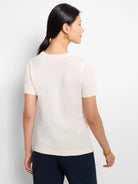 Off-white scoop-neck cotton sweater tee with short sleeves.  Rear view.