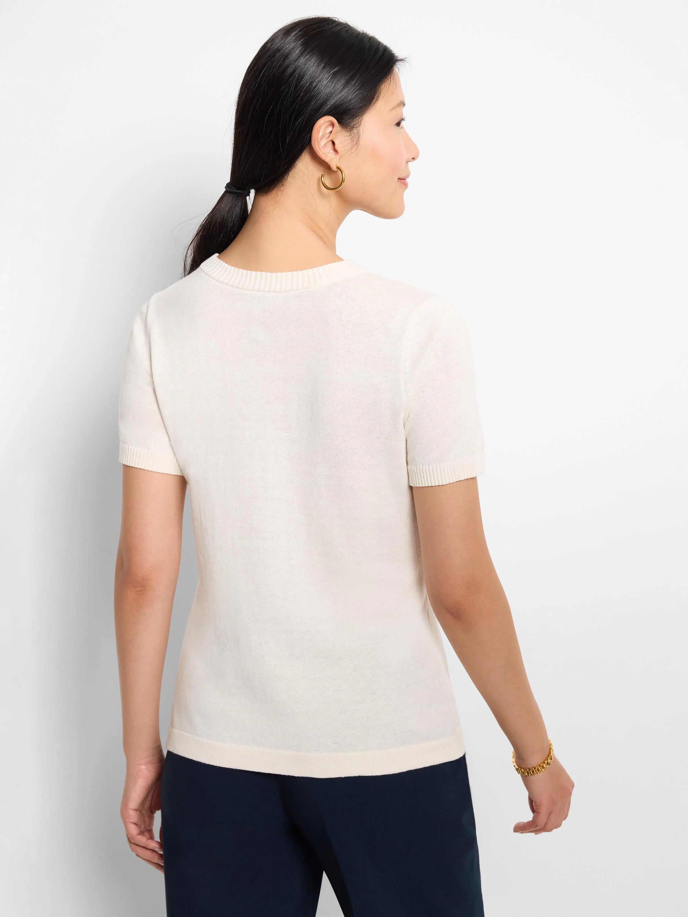 Off-white scoop-neck cotton sweater tee with short sleeves.  Rear view.