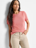 Pink cotton sweater tee with short sleeves and scoop neck.