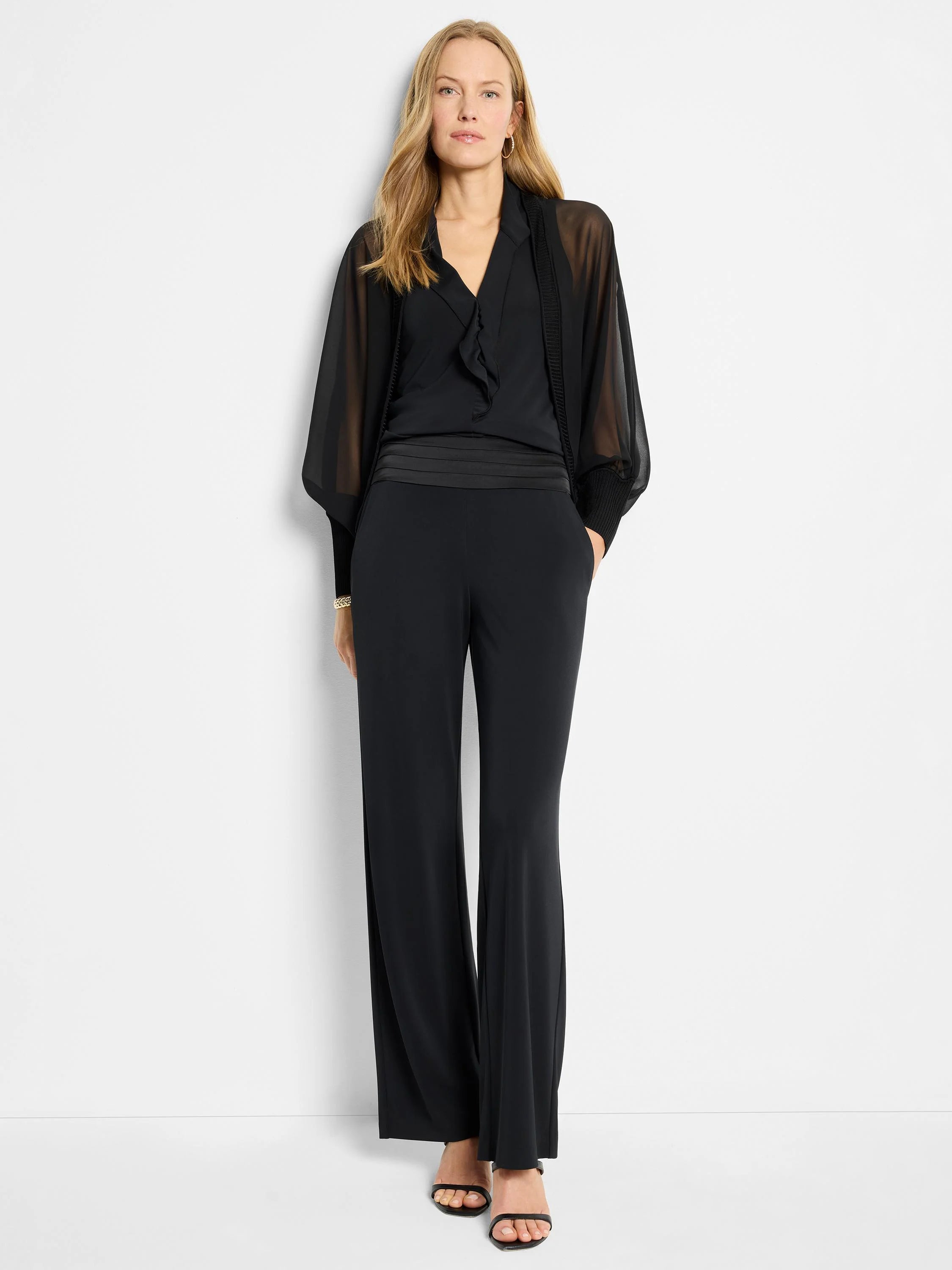 Black sheer chiffon cardigan,  loose sleeves, over black top & pants.  Wide-leg pants with satin waistband.